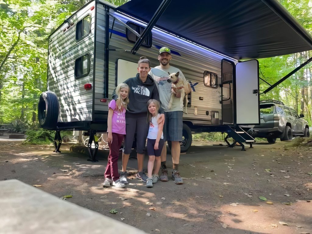 the Bowen family standing outside their RV