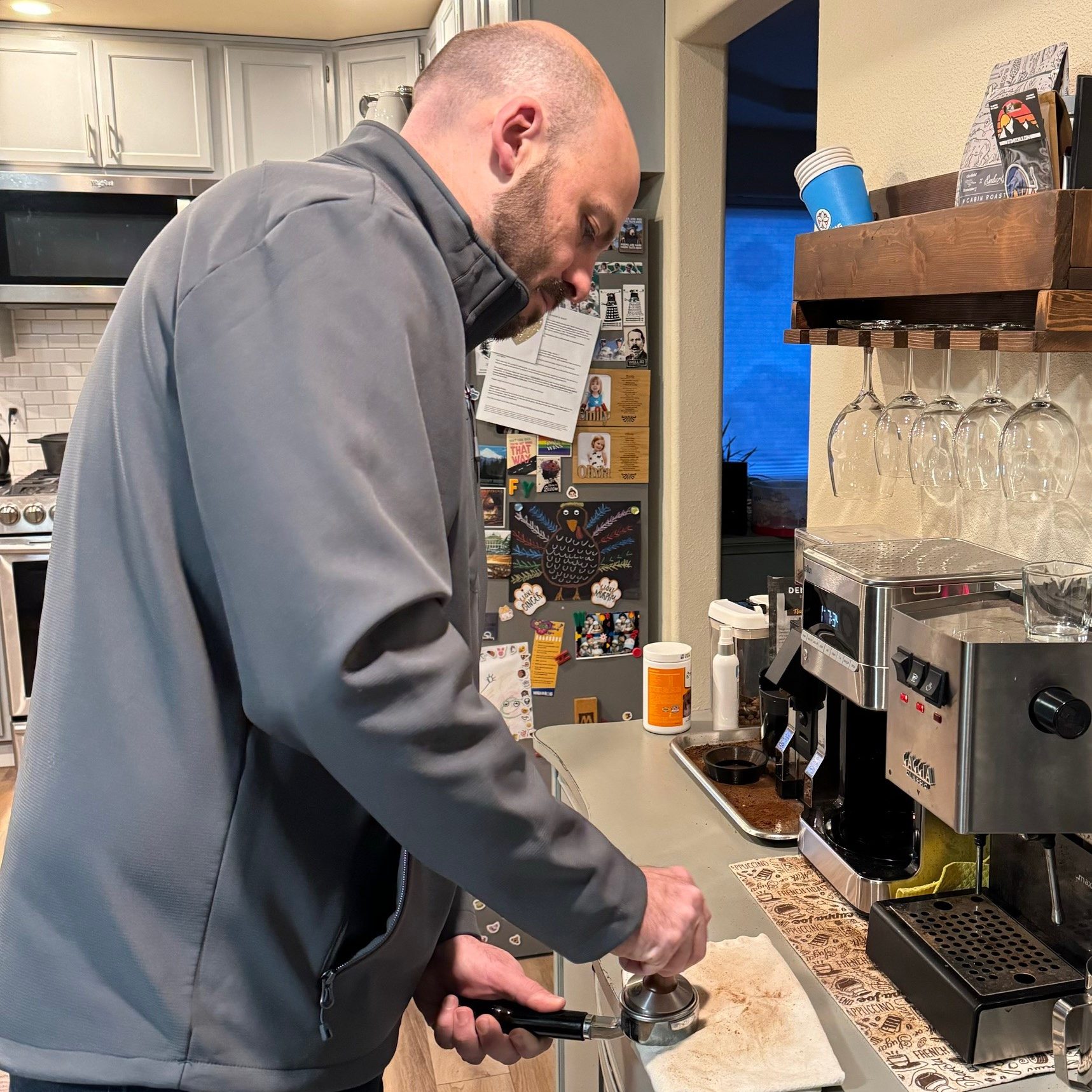 Mike Bowen at his kitchen counter making espresso