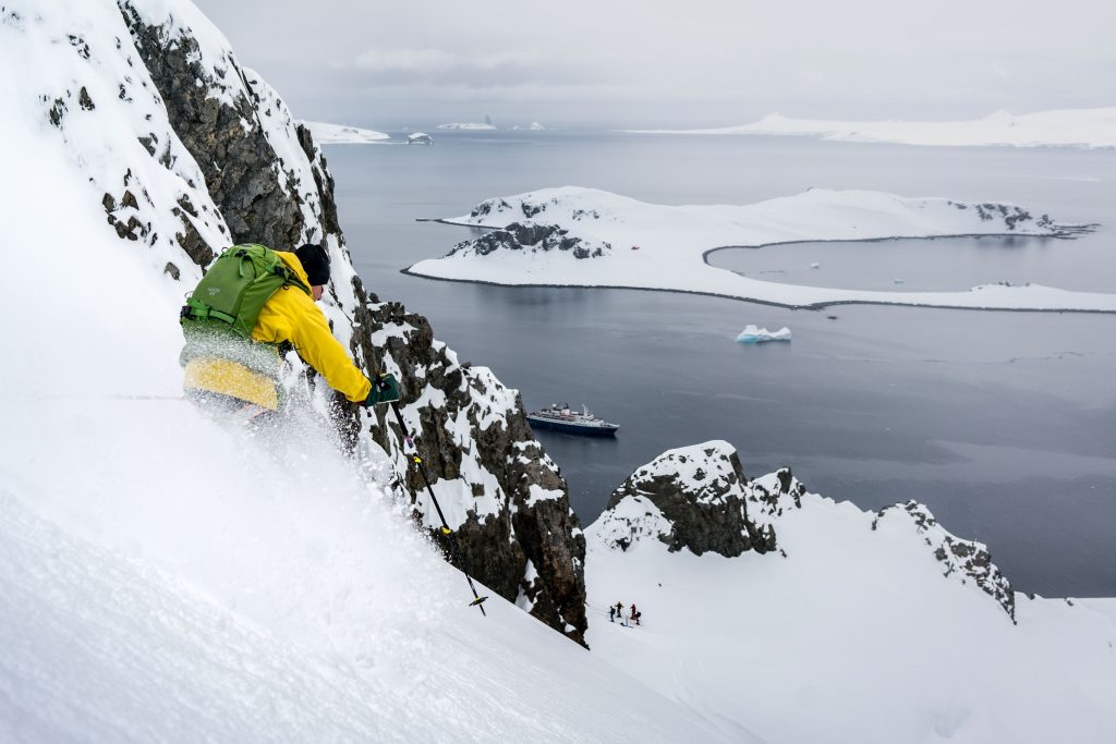 Tom Helpenstell skiing down a slope in Antarctica