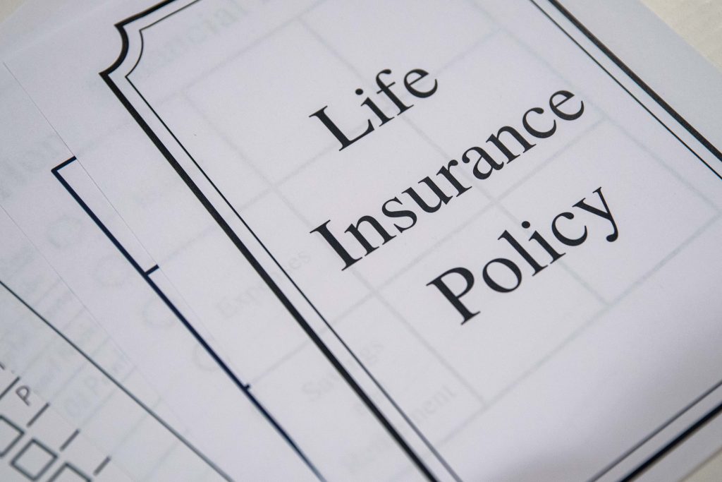 white piece of paper with a black border that says life insurance policy