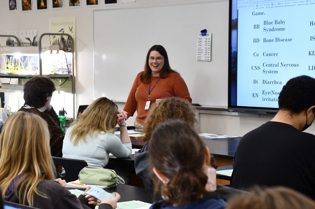 Heidi Heiser standing in front of a high school classroom