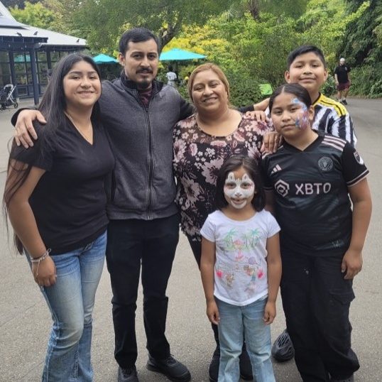 a family poses for a photo