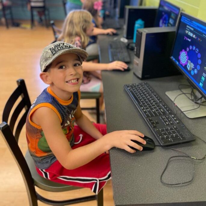 kids sitting at the Olympia Boys & Girls Clubs computers