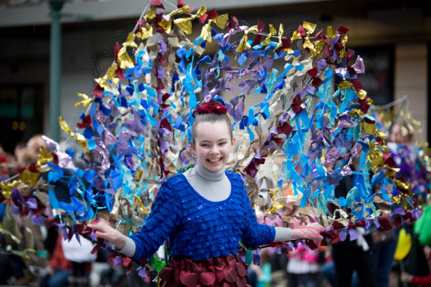 woman dressed as a peacock for the Procession of the Species in Olympia