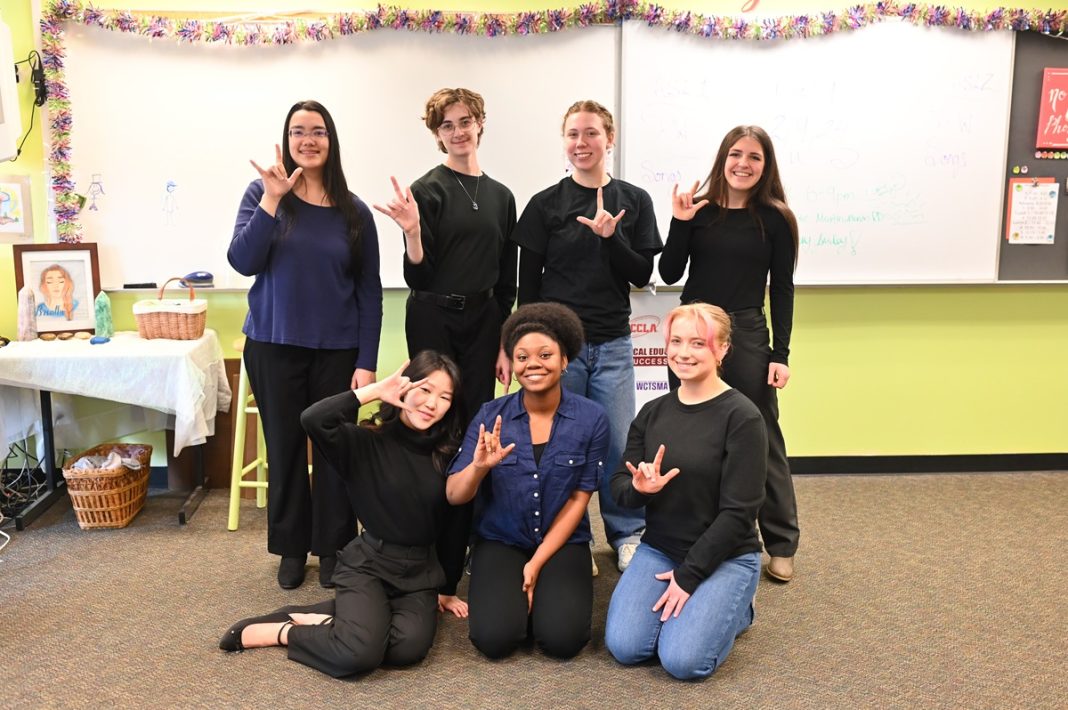 River Ridge High School ASL 3 students signing and posing for a photo