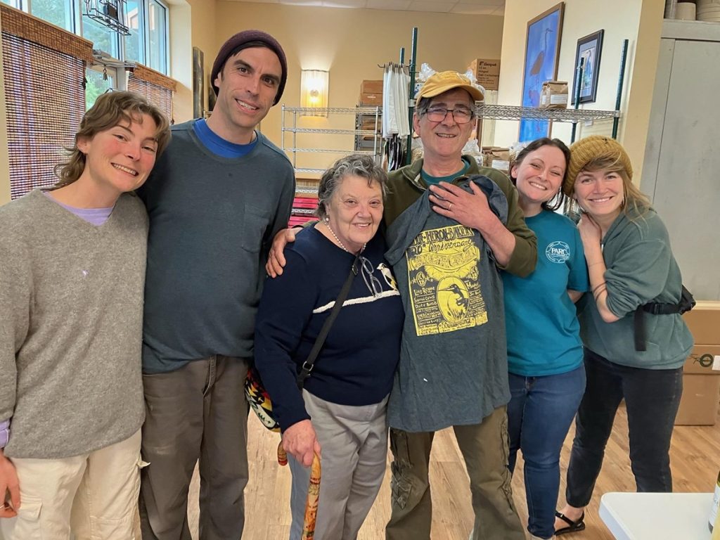 six Blue Heron staff members standing in a row posing for a photo