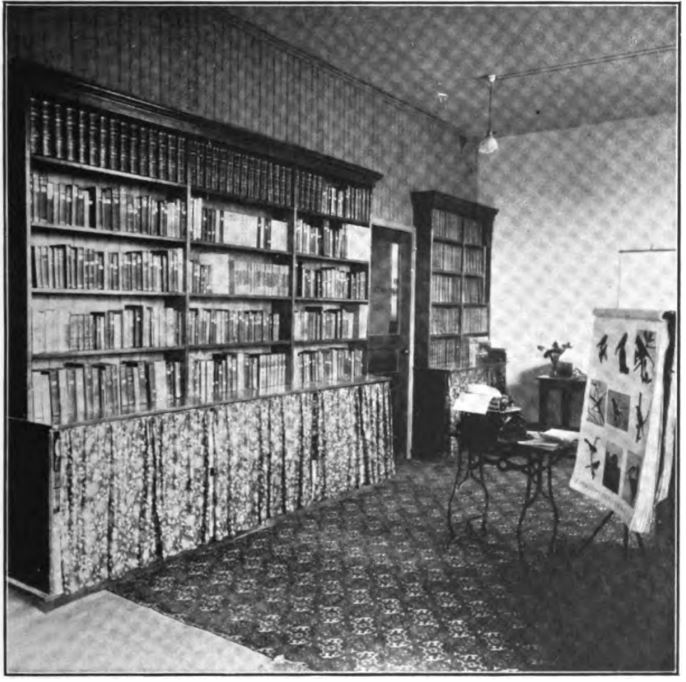 black and white photo of book shelves full of books