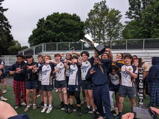 The Budd Bay Barbarians pose for a team photo with their Division 2 trophy.