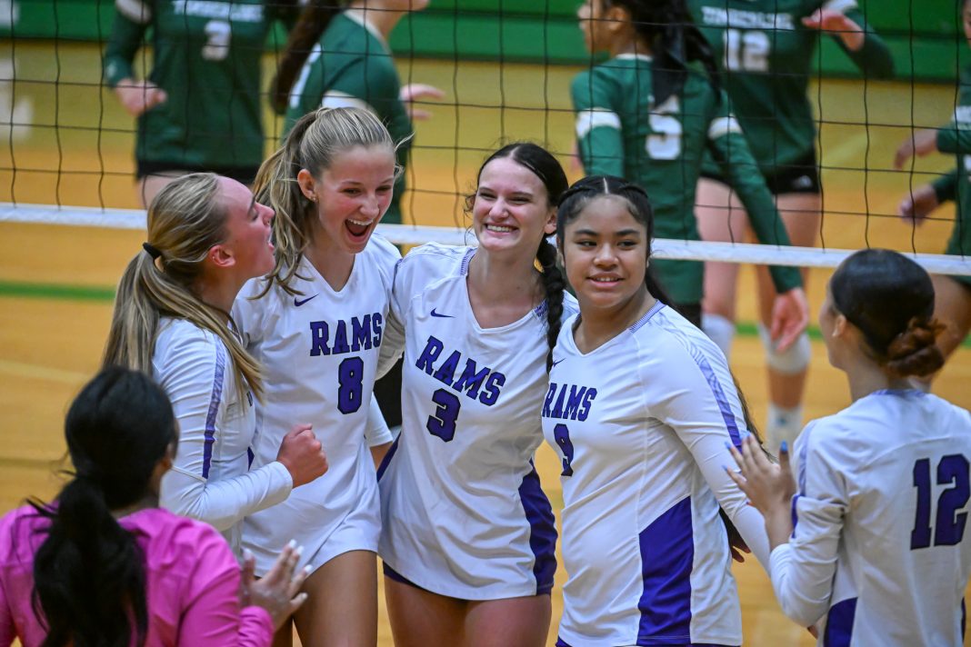 girls playing volleyball