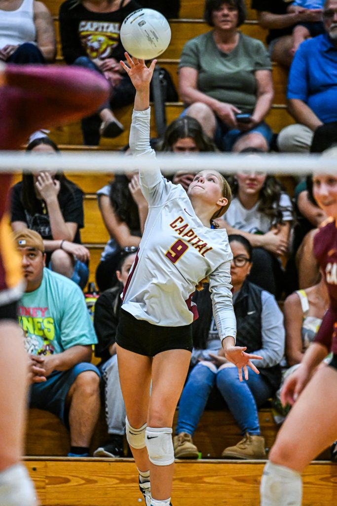 girls at the net blocking during volleyball