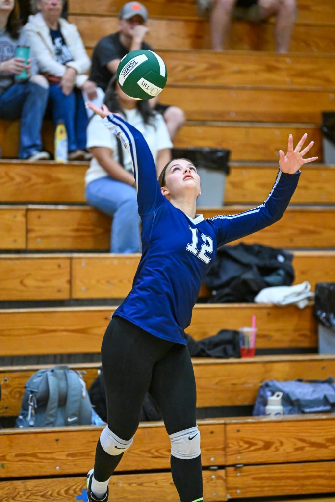 girl spiking a volleyball