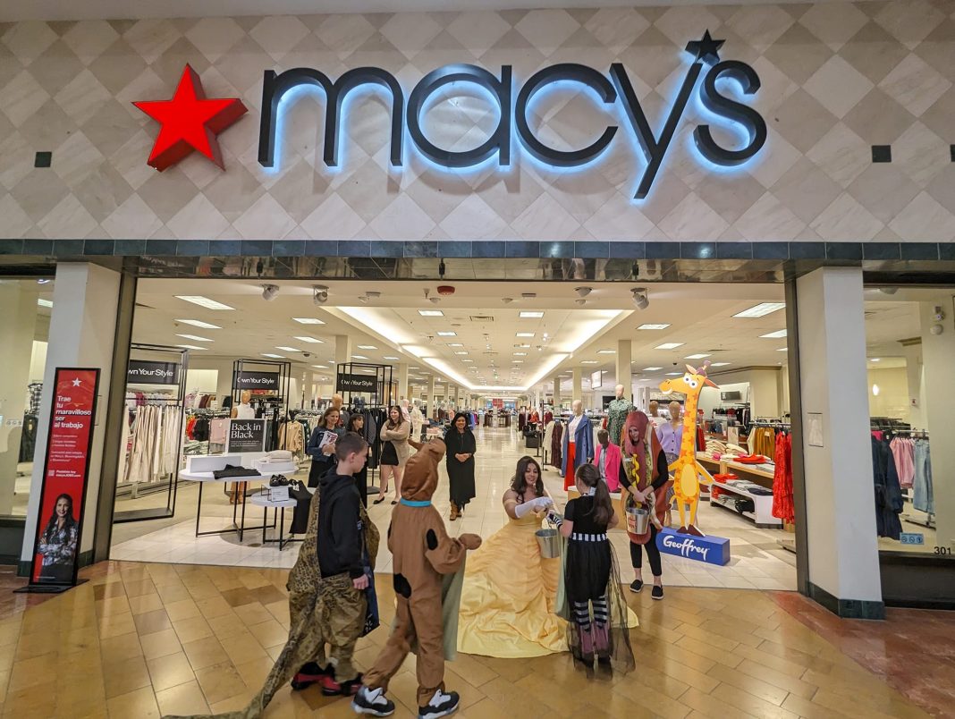 people in Halloween costumes outside Macy's