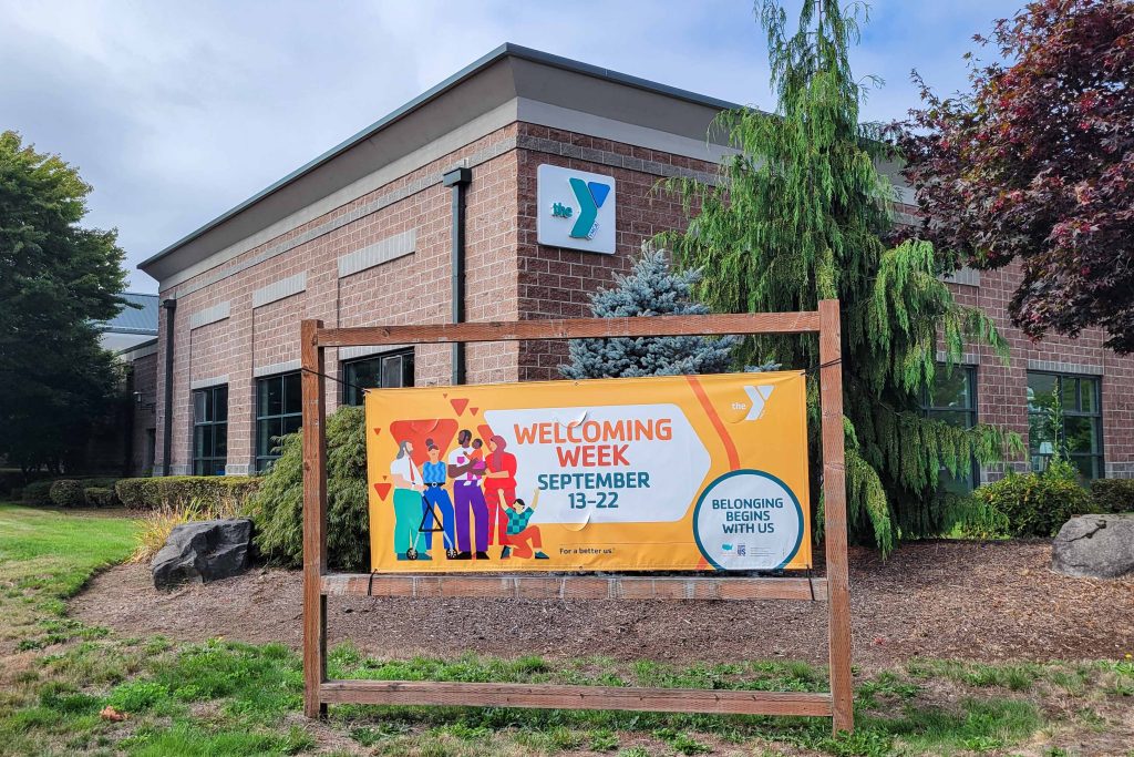 The Briggs Community YMCA building with a banner outside