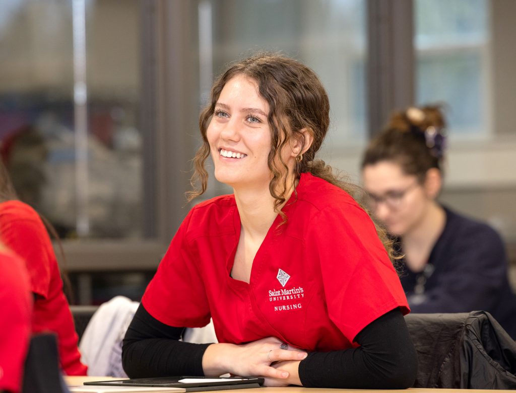 Saint Martin's University Nurse students in red polos sitting at desks