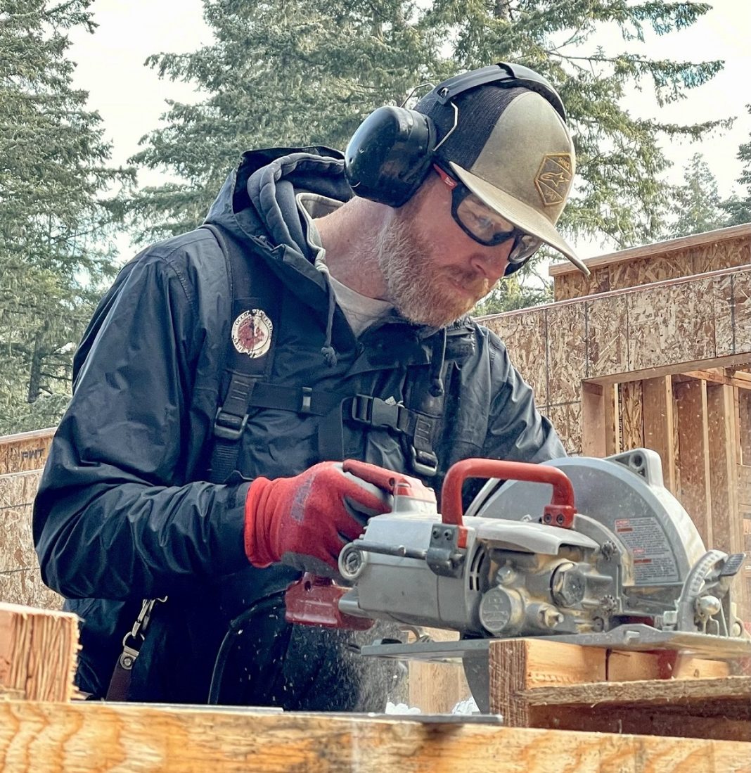 Sean O'Leary using an electrical table saw