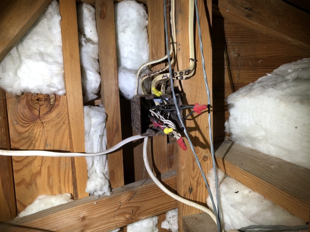 Uncovered junction box on a hosue