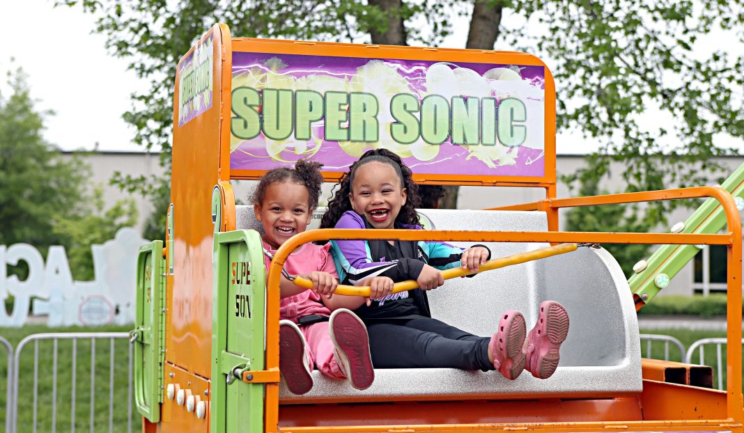 two girls in a carnival ride car