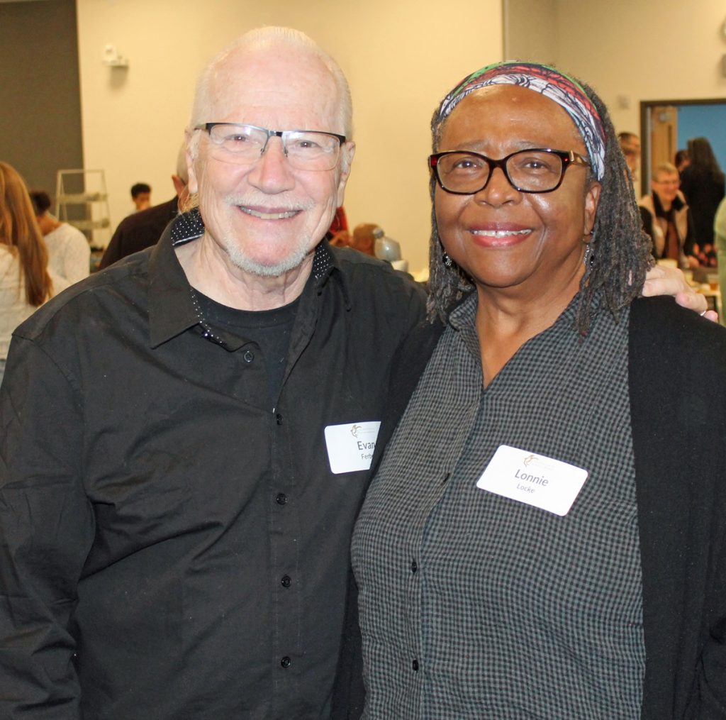 Dispute Resolution Center Founding Executive Director - and the Peacemaker Award's namesake - Evan Ferber (left) and Lonnie Locke (right) standing next to each other for a photo