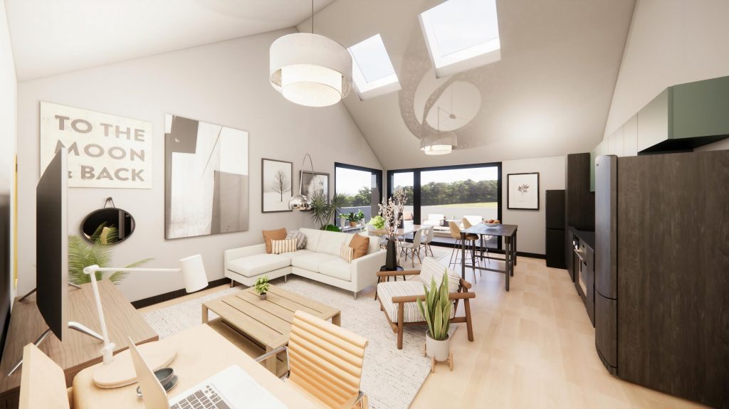 A living room at The Rookery with white couch and chair, brown entertainment system, a brown dining room table and a desk with a computer.. Mirror and artwork are the wall, including a sign that says "To the moon and back."