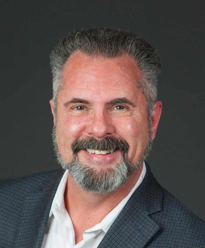 J. David Hall in a white shirt and suit jacket - head shot