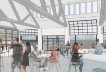 Rendering of a spacious cafeteria-style building with people sitting and walking around