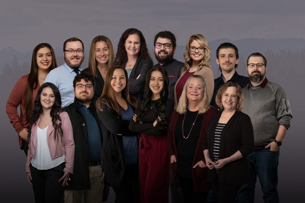 a group photo of the Melanie Bakala State Farm Team in business casual attire.